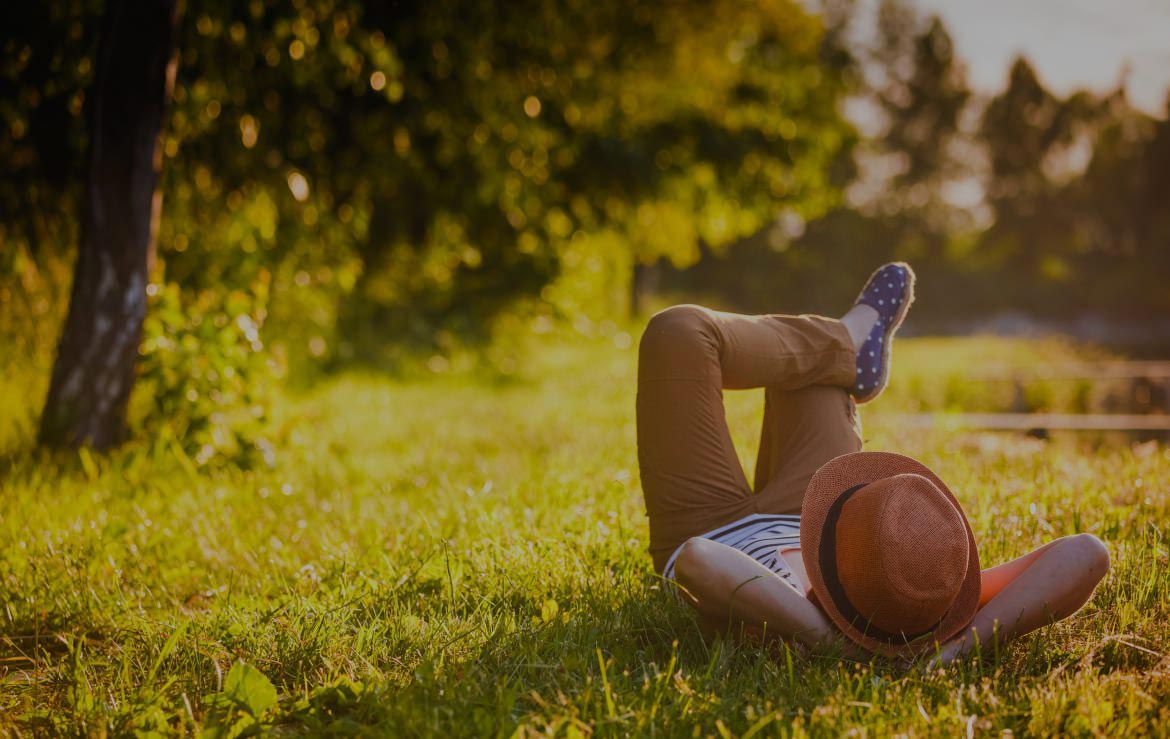 Person Laying on Grass